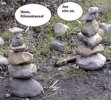 a stack of rocks with speech bubbles that say `` hmm , kiinnostaa ! ''