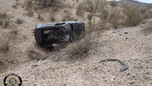 a picture of a car that has fallen off the side of a mountain