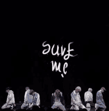 a group of people are kneeling down in front of a black background with the words " soon fame " written on it