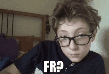 a young boy wearing glasses and a shirt that says fr?