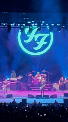 a group of people on a stage with a ff logo