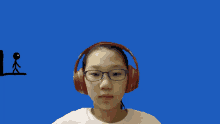 a girl wearing headphones and glasses against a blue background with stick figures