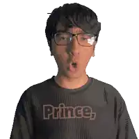 a man wearing glasses and a black shirt that says prince on it