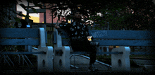 a man sits on a bench that has the word vans written on it