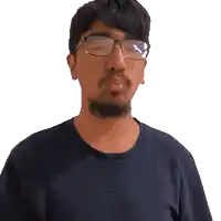 a man wearing glasses and a blue shirt is blowing a kiss