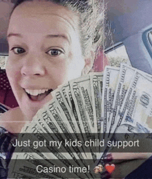 a woman in a car holding a fan of 20 dollar bills with the caption just got my kids child support casino time