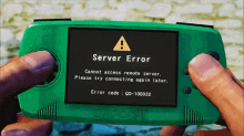 someone is holding a green device that says server error on the screen