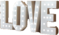 a lighted sign that says love with white dots