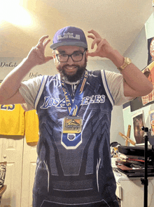 a man wearing a los angeles jersey and a medal