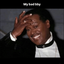 a man in a tuxedo is smiling with his hand on his forehead and the caption my bad bbv