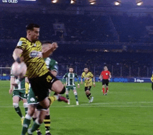 a man in a yellow and black jersey with the number 10 on it