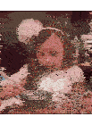 a little girl with a white flower in her hair is eating from a bowl with chopsticks