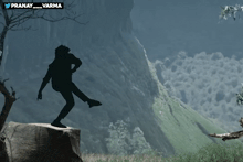 a poster for mega power star ram charan with a silhouette of a person on a rock