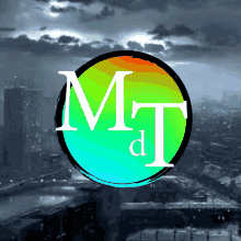 a colorful circle with the letters m and t on it