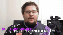 a man with glasses and a purple shirt says pretty confident