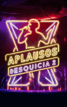 a neon sign that says aplausos desquicia 2