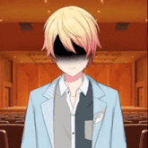 a boy with blonde hair and a black face is standing in front of a stage .