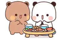 a couple of bears are sitting at a table eating food .