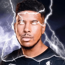 a man is standing in front of a lightning storm with lightning bolts coming out of his eyes .