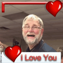 a man with glasses and a beard is surrounded by red hearts and says i love you .