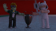 a boy with the number 8 on his shirt holds a trophy next to another boy