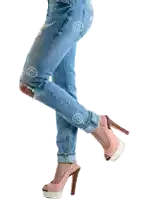 a woman wearing a pair of pink high heels and jeans