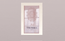 a picture frame with a picture of a mandala and the word tawakkul on it .