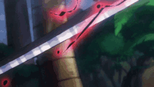 a close up of a sword with a red light coming out of it in a cartoon .