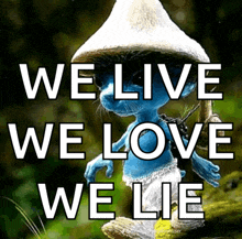 a picture of a smurf with the words we live we love we lie on it