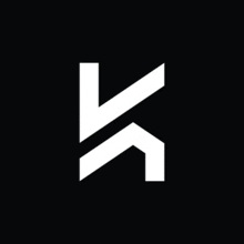 a white letter k on a black background with a diagonal arrow .