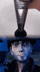 a person is holding a small object on top of a man 's head