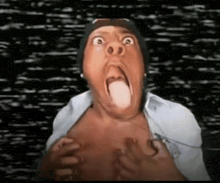 a man with his tongue hanging out is making a funny face