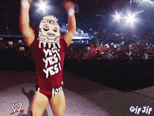 a wrestler wearing a red shirt that says " yes yes yes "