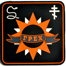 a black and orange patch with a sun and the word tpex