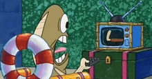 a cartoon character is holding a remote control in front of a television with the letter l on the screen .