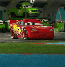 a red lightning mcqueen car with the number 94 on it