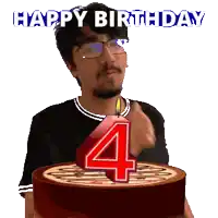 a man blowing out a number four candle on a cake