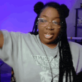 a woman wearing glasses and a t-shirt that says " angry birds "