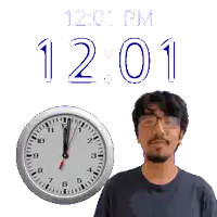a man with glasses is standing next to a clock that says 12:01 pm