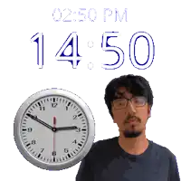 a man stands in front of a clock that says 14:50