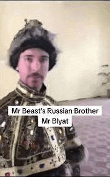 a man in a costume is standing in a room wearing a russian brother hat .