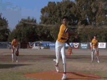 a baseball pitcher is getting ready to throw a ball on a field with a sign that says found on it