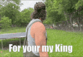 a man with a backpack stands in front of a trampoline with the words " for your my king " above him