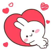 a bunny is laying on a red heart surrounded by other hearts