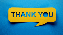 a yellow speech bubble with the word thank you cut out of it