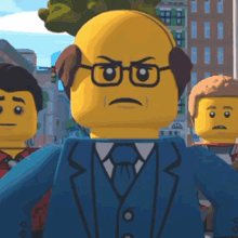 a lego man wearing glasses and a blue suit has an angry expression on his face