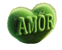 a green heart shaped pillow with the word amor on it