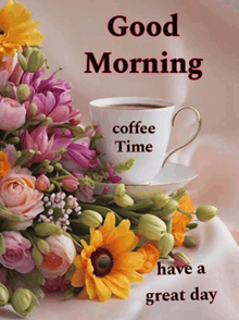 a cup of coffee sits on a saucer next to flowers and says good morning