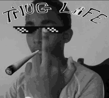 a man wearing sunglasses that say thug life is smoking a joint