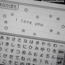 a black and white photo of a keyboard with the words i love you written on it